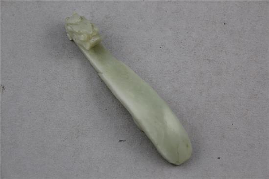 A Chinese pale celadon jade belt hook, 19th century, 9.8cm.